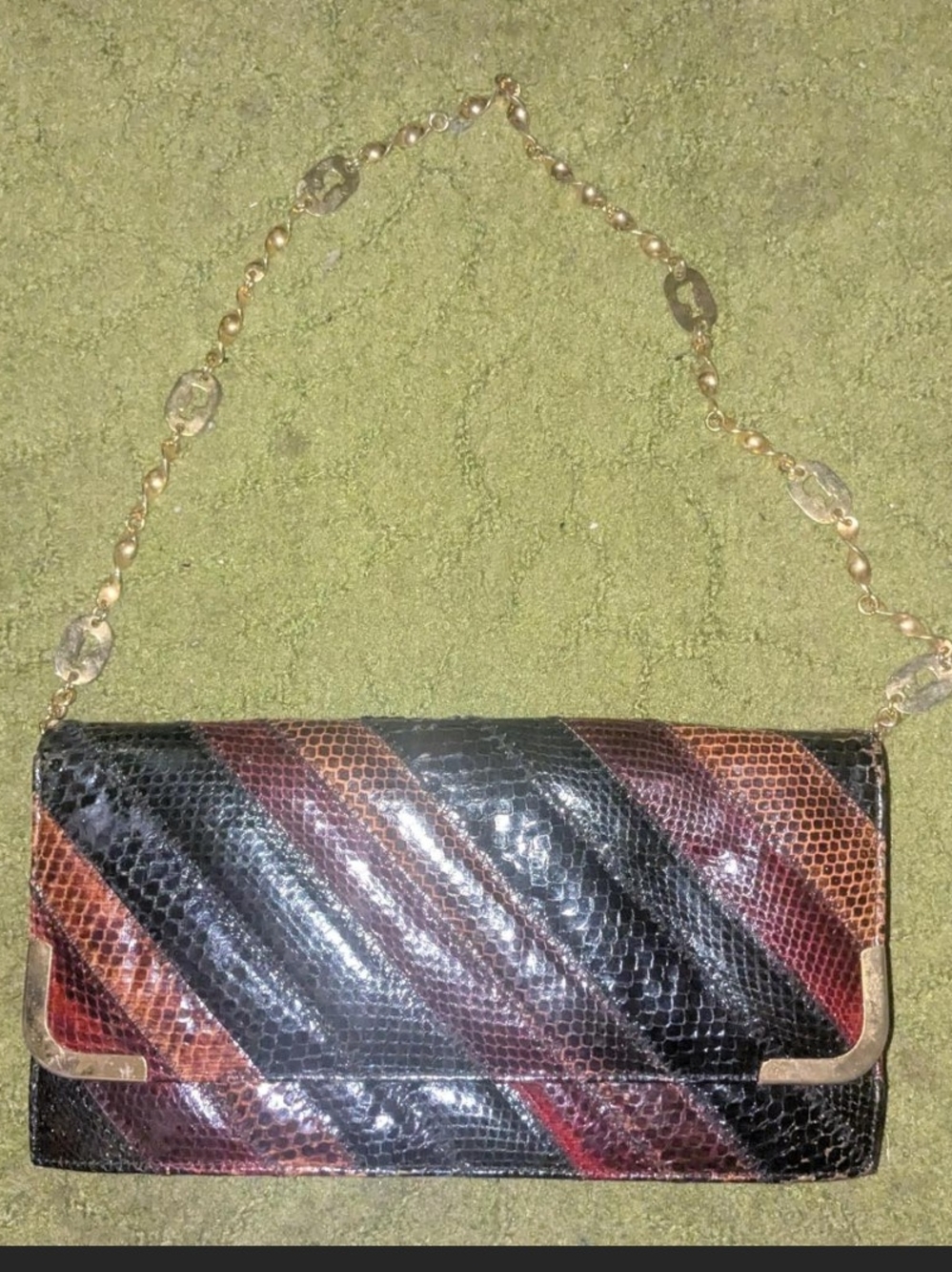 Diagonal Striped Python-Effect Clutch in Black and Brown